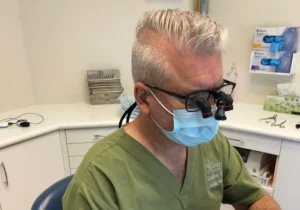 Amexors dentist_man_wearing_angled_loupes_result